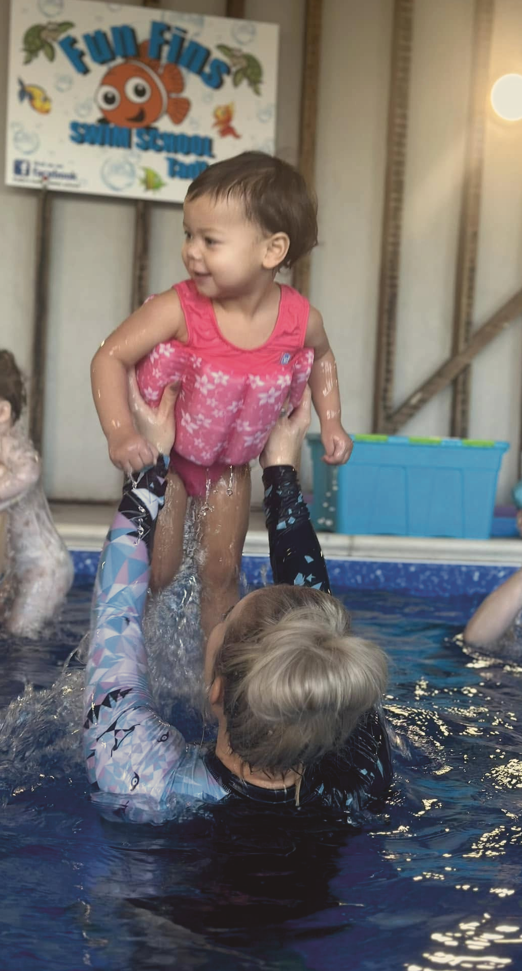 Children enjoying a swimming lesson